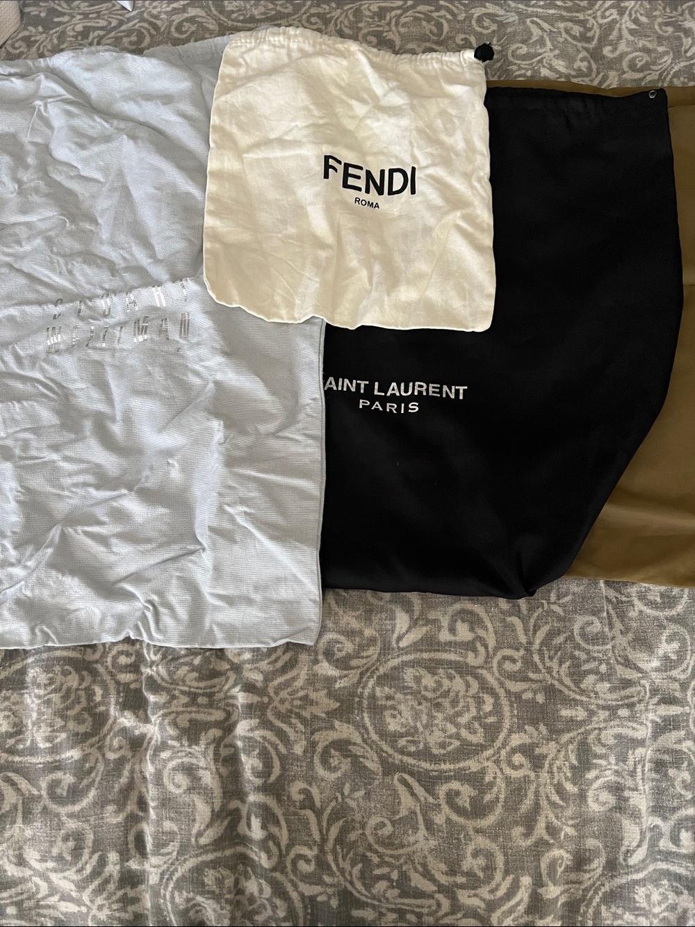 Lot of 4 travel bags fendi, Whitman, Saint Laurent and Hartmann